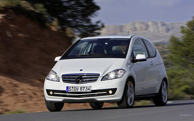 white mercedes-benz a-class driving