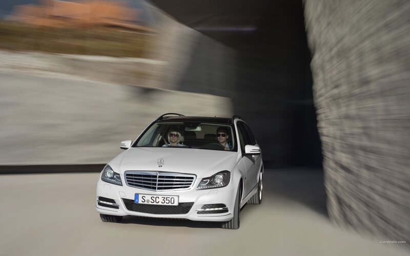 White Mercedes-Benz C-Class driving through tunnel