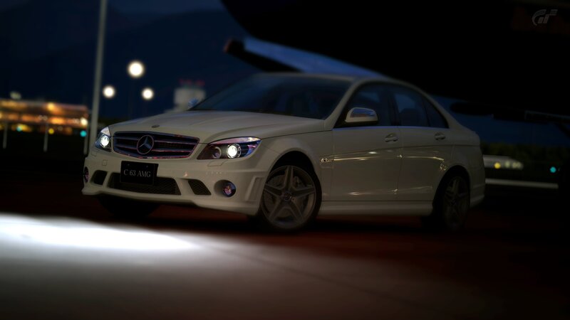 White Mercedes-Benz C63 AMG at night