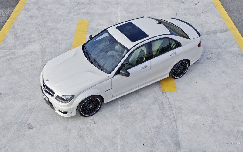 white mercedes-benz c63 amg parked