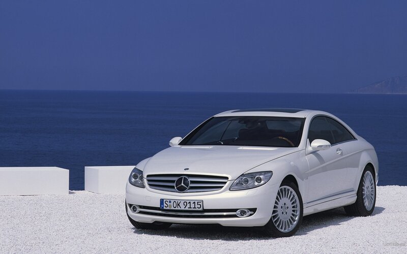 White Mercedes-Benz CL-Class by the sea