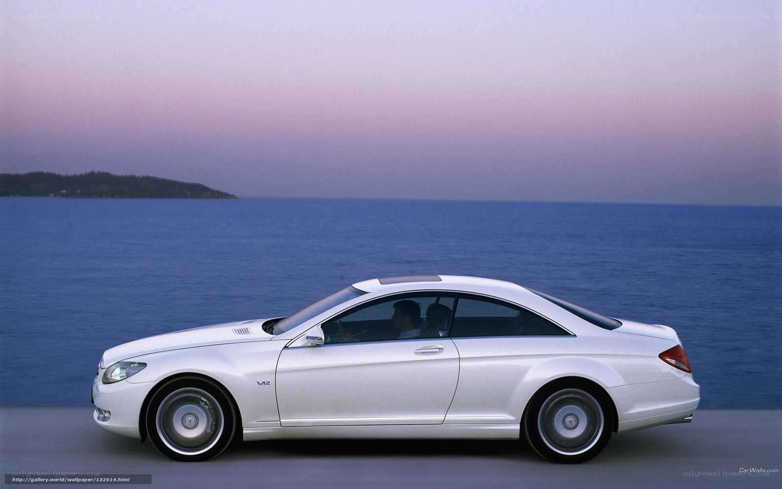 White Mercedes-Benz CL55 AMG by the sea