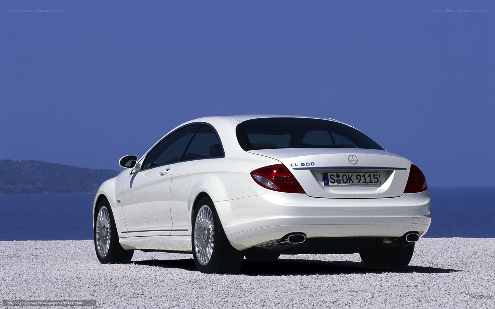 White Mercedes-Benz CL600 by the sea