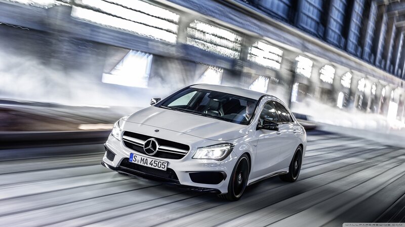 white mercedes-benz cla45 driving