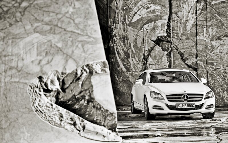White Mercedes-Benz CLS in a rocky setting