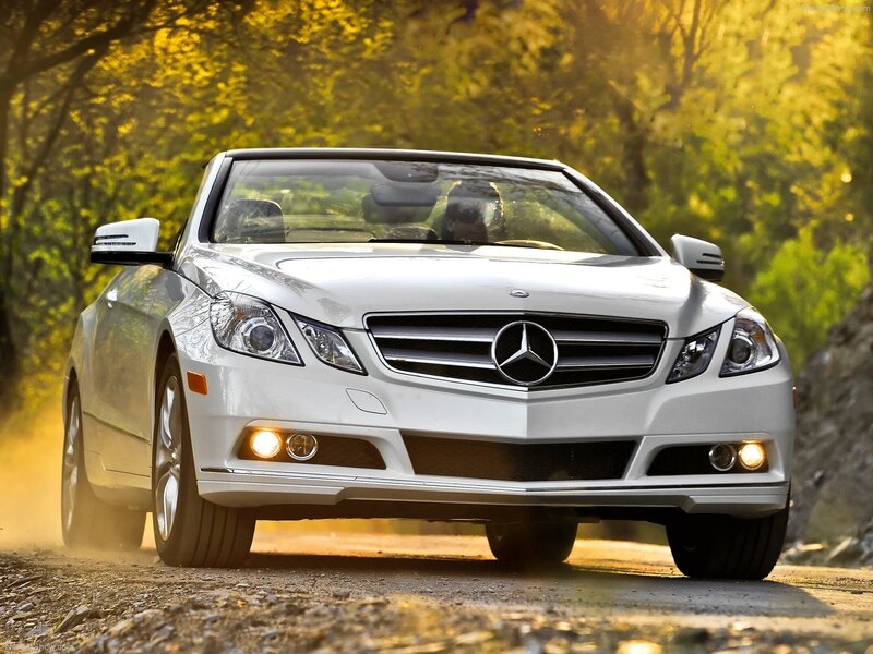 White Mercedes-Benz convertible on a road