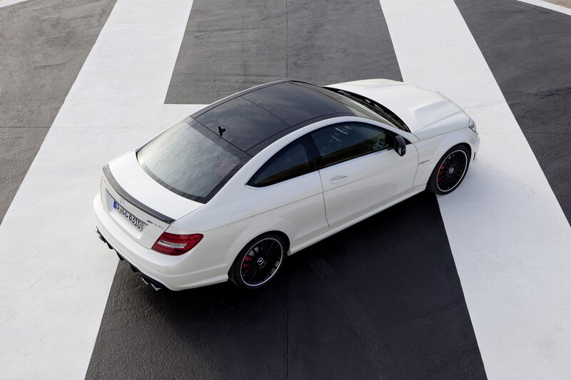 white mercedes-benz coupe on track