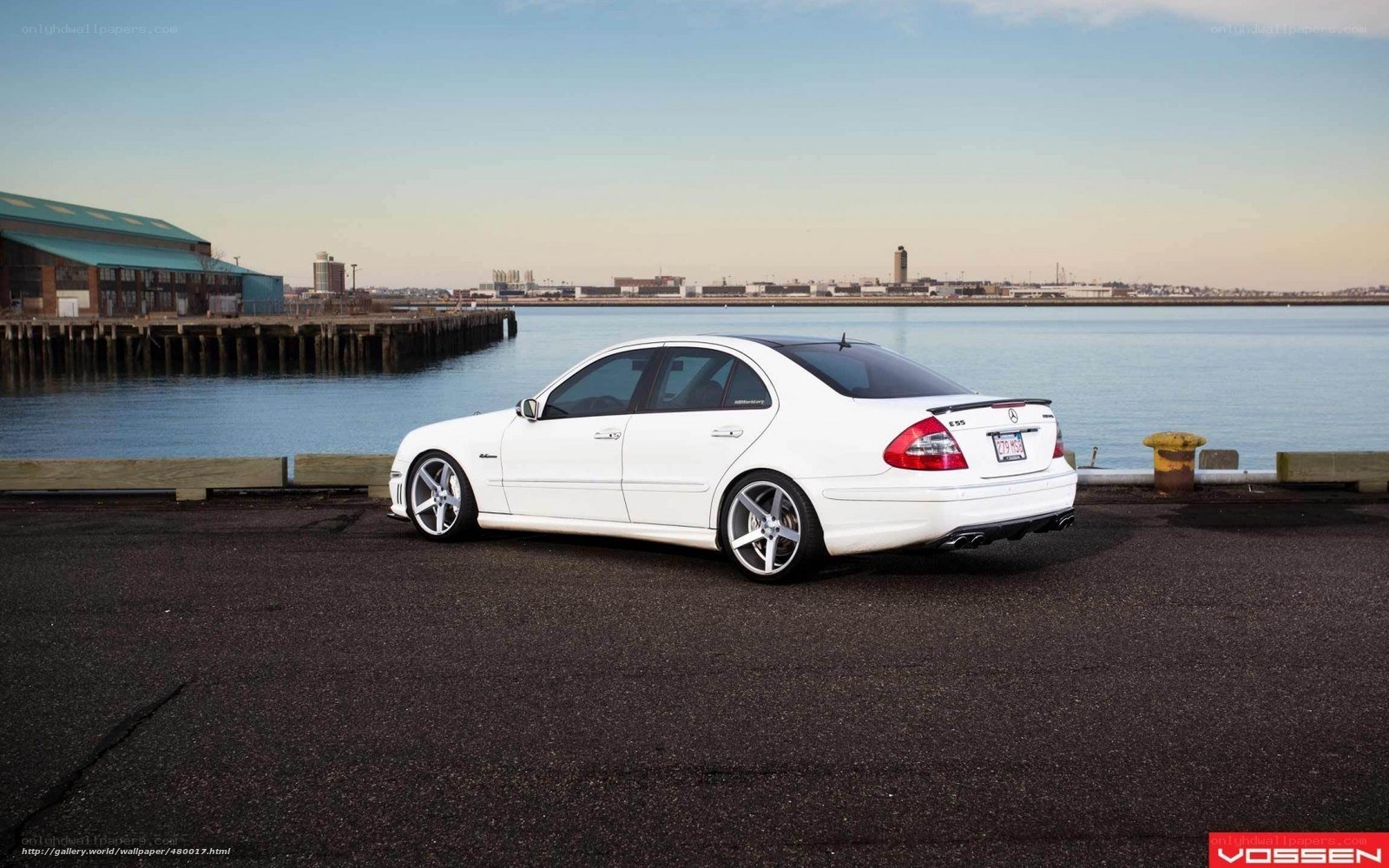 white mercedes-benz e55 at dock