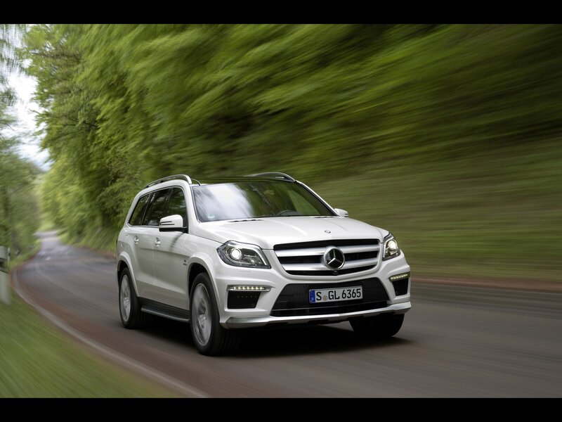 White Mercedes-Benz GL550 driving