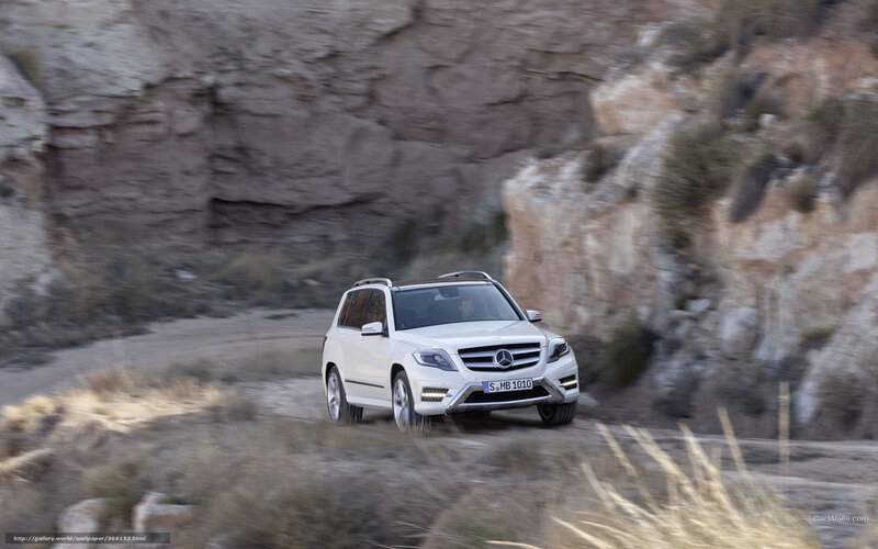 White Mercedes-Benz GLK driving on dirt road