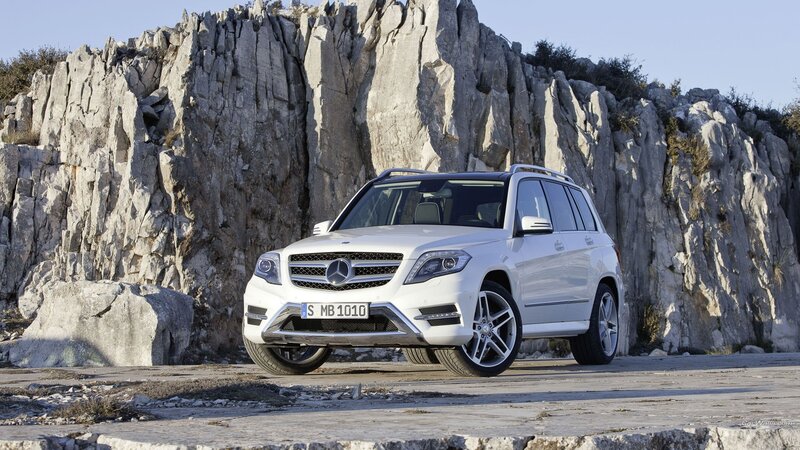 White Mercedes-Benz GLK parked by cliffs