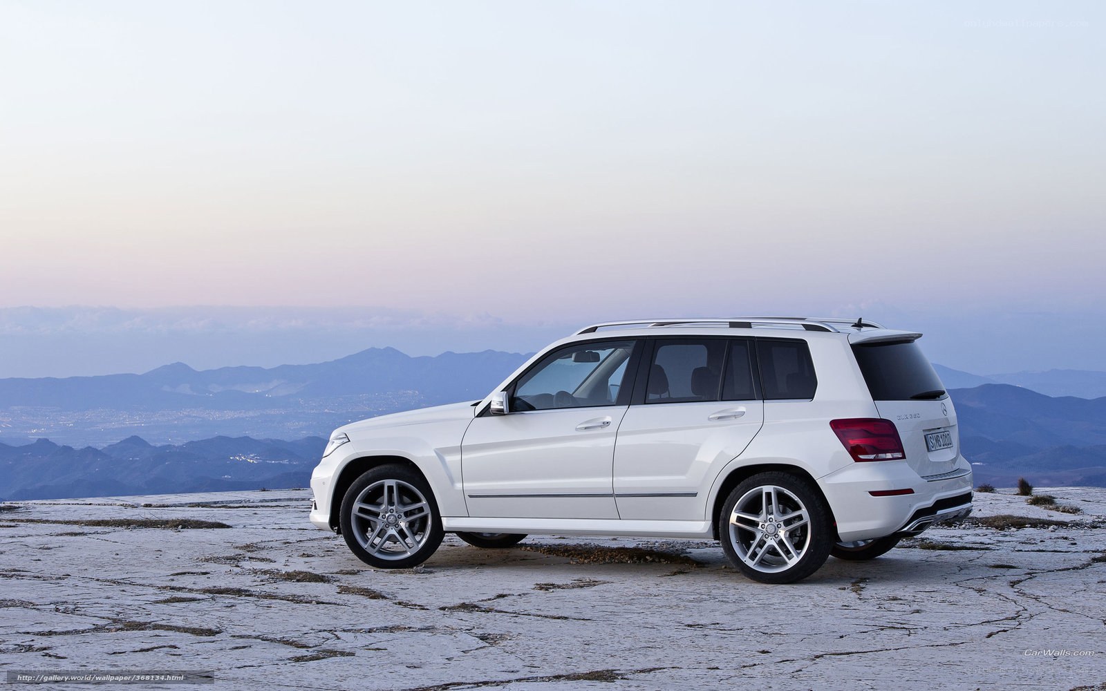 White Mercedes-Benz GLK parked on a cliff