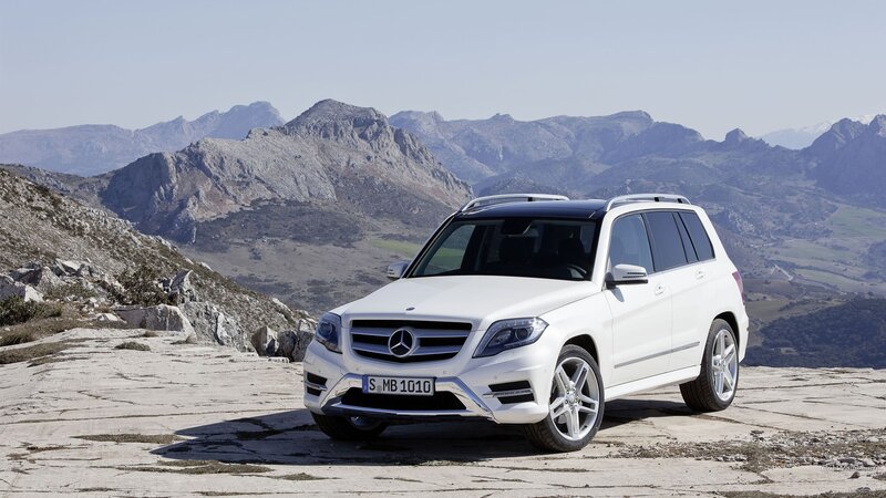 White Mercedes-Benz GLK parked on a mountain