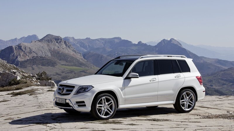 White Mercedes-Benz GLK parked on a mountain