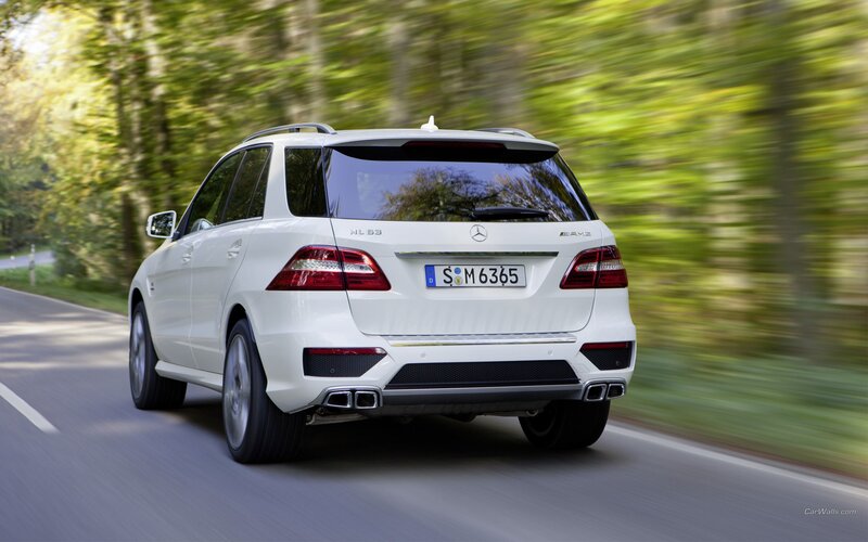 White Mercedes-Benz ML63 AMG driving