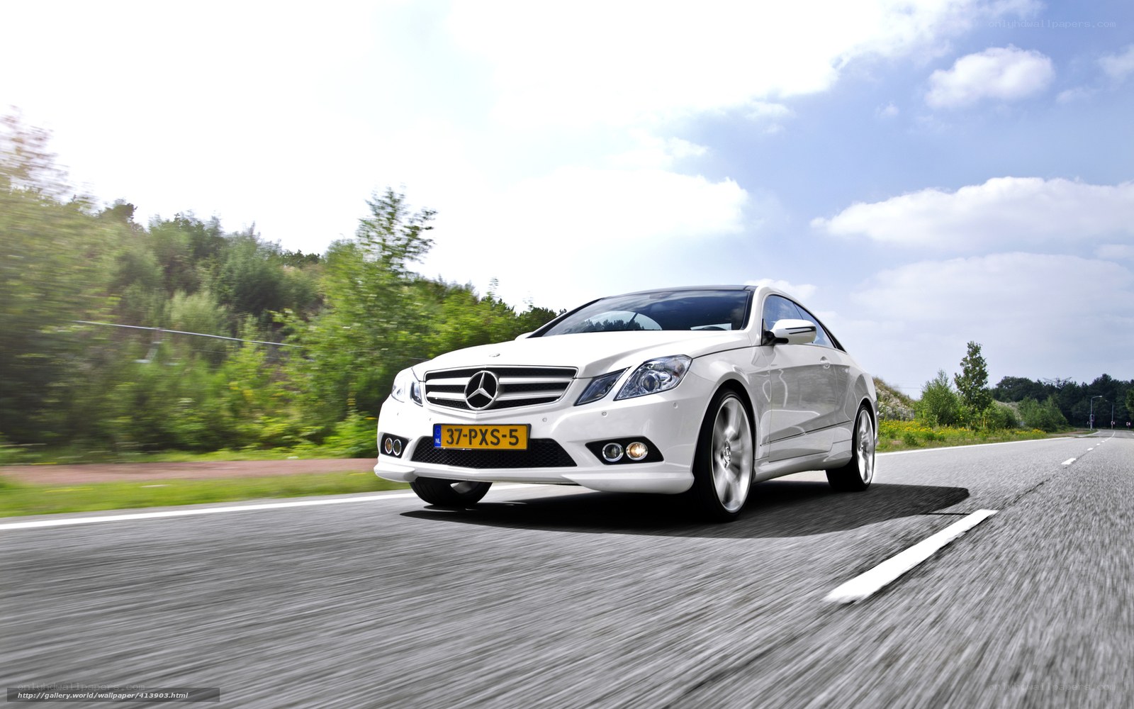 White Mercedes-Benz on a country road