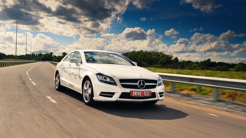 White Mercedes-Benz on a highway