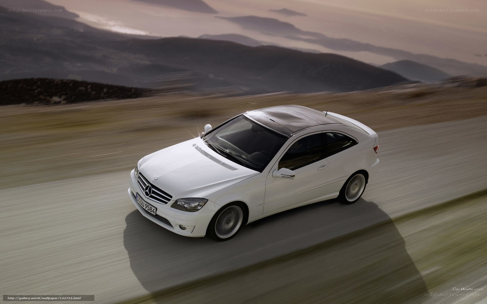 White Mercedes-Benz on a mountain road