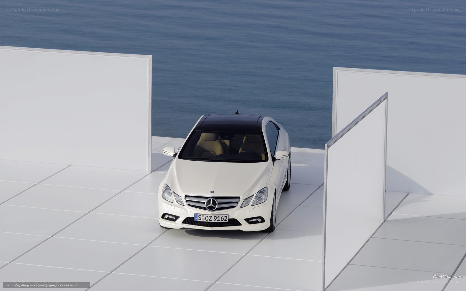 White Mercedes-Benz on a platform