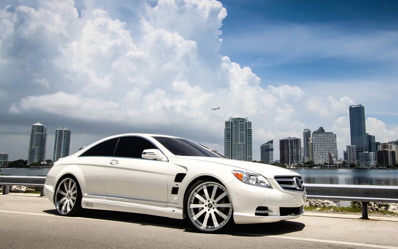 White Mercedes-Benz on city road