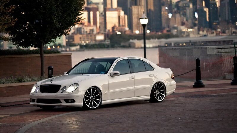 white mercedes-benz on city street