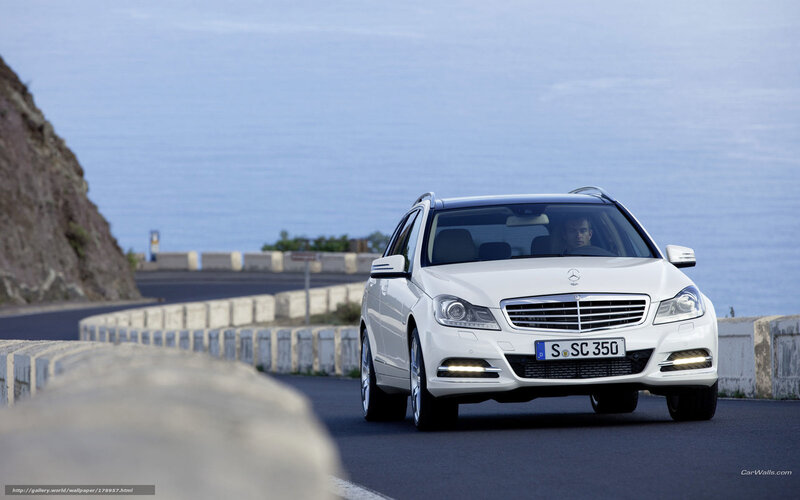 White Mercedes-Benz on coastal road