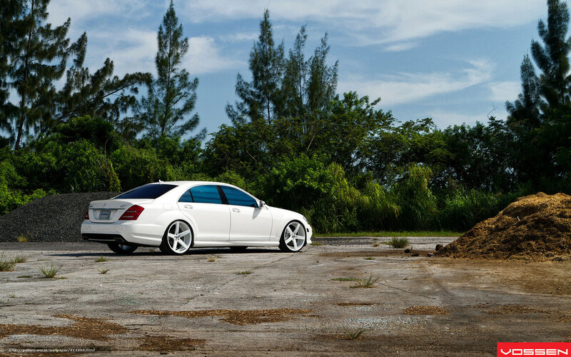 white mercedes-benz on concrete
