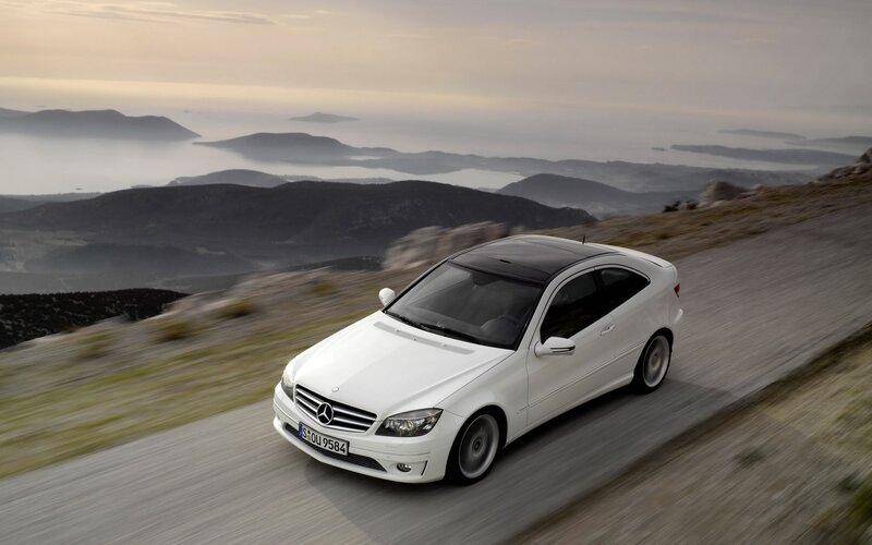 White Mercedes-Benz on mountain road