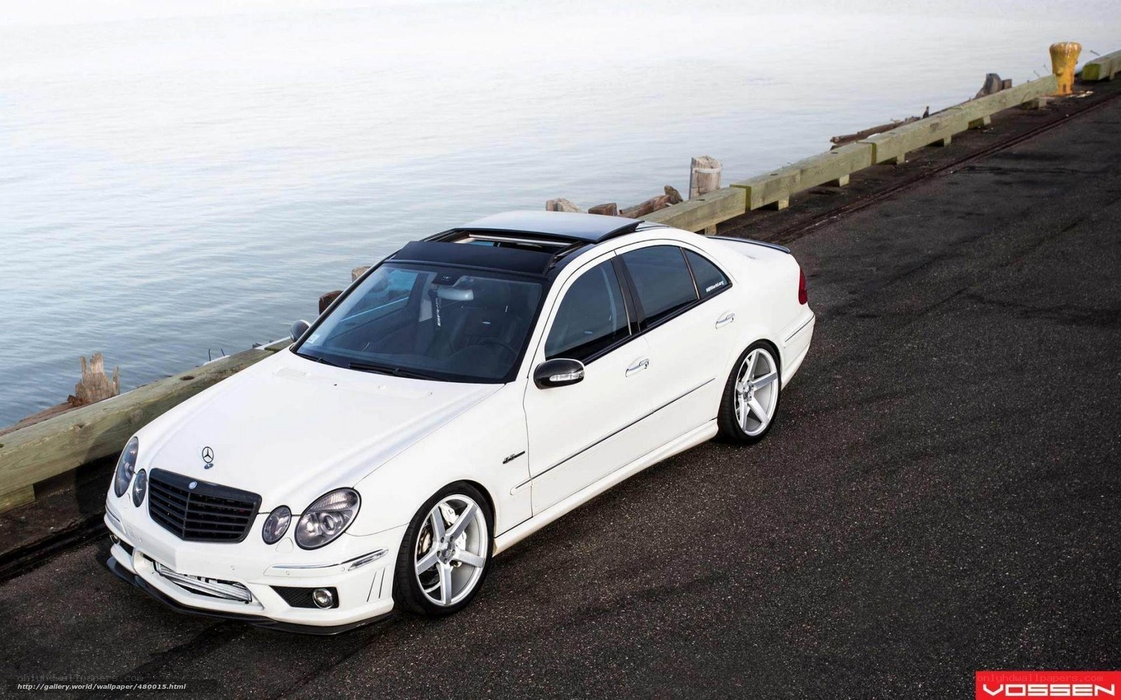 white mercedes-benz on pier