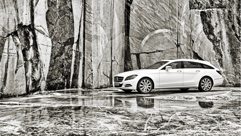White Mercedes-Benz on wet pavement