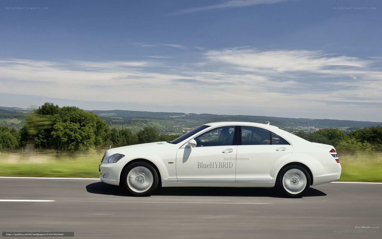 White Mercedes-Benz S-Class driving
