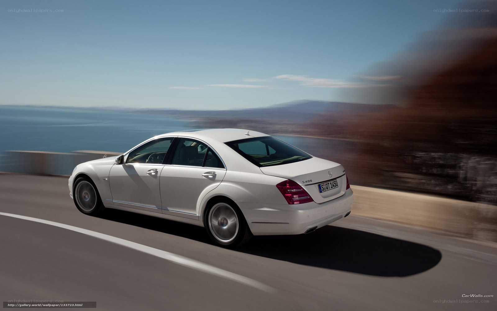White Mercedes-Benz S400 driving