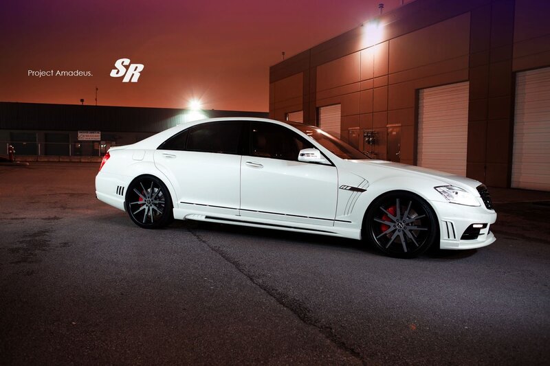 white mercedes-benz sedan