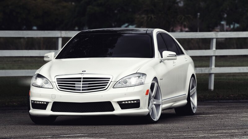 white mercedes-benz sedan
