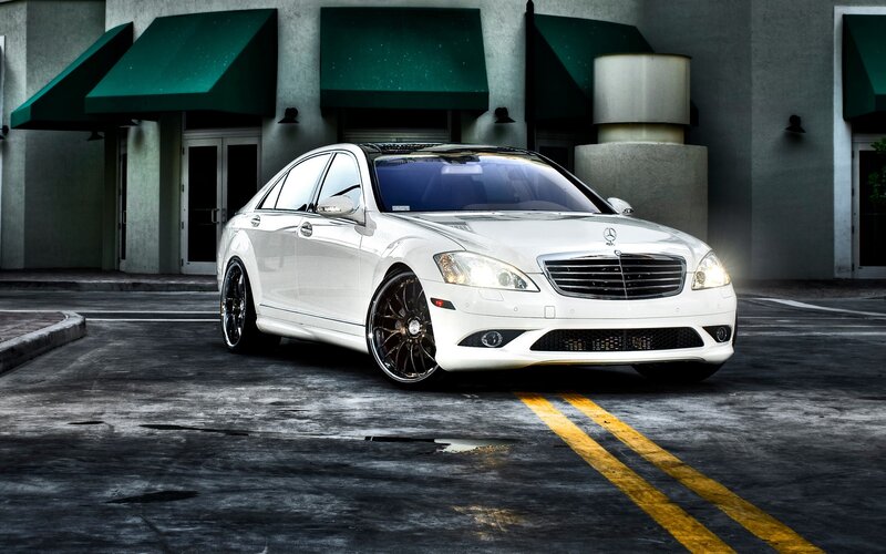 white mercedes-benz sedan