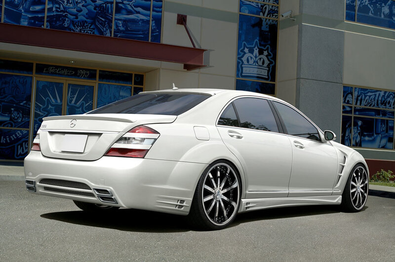 white mercedes-benz sedan