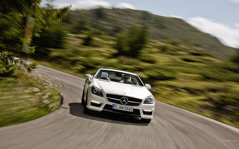 White Mercedes-Benz SLK driving on a road