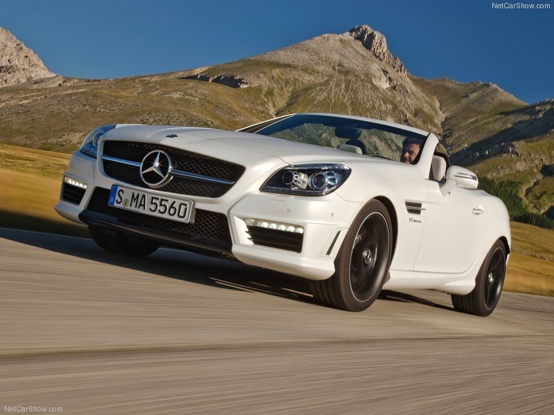 White Mercedes-Benz SLK driving on mountain road