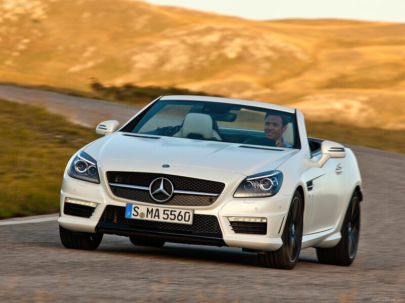 White Mercedes-Benz SLK driving on road