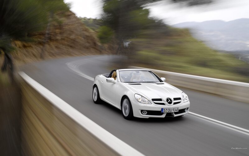 White Mercedes-Benz SLK on a winding road