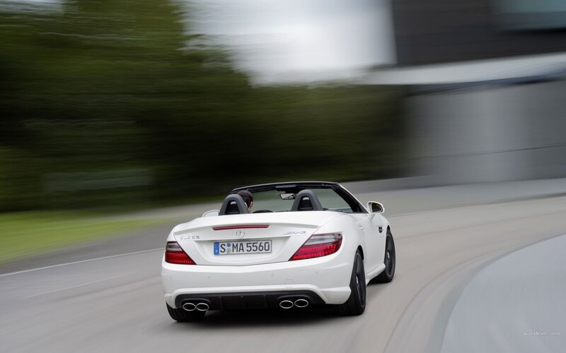 white mercedes-benz slk55 amg driving