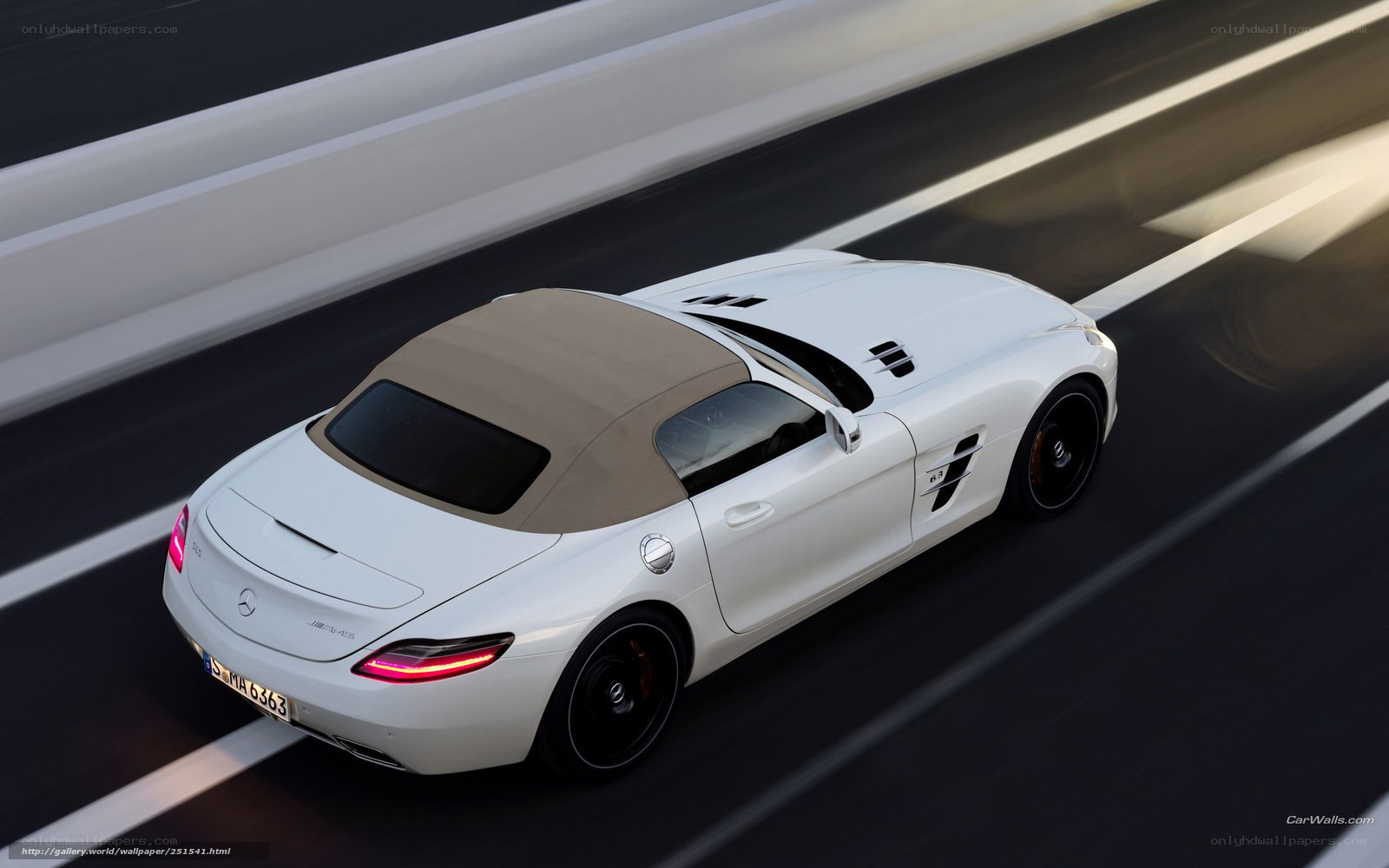 White Mercedes-Benz SLS AMG driving