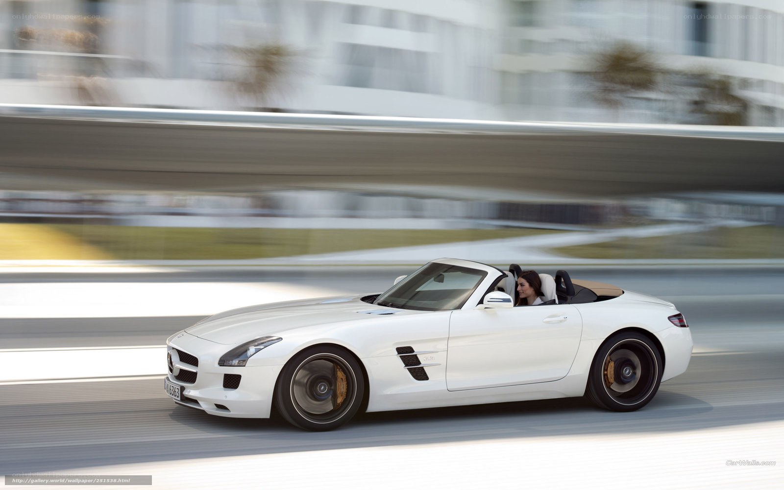 White Mercedes-Benz SLS AMG driving