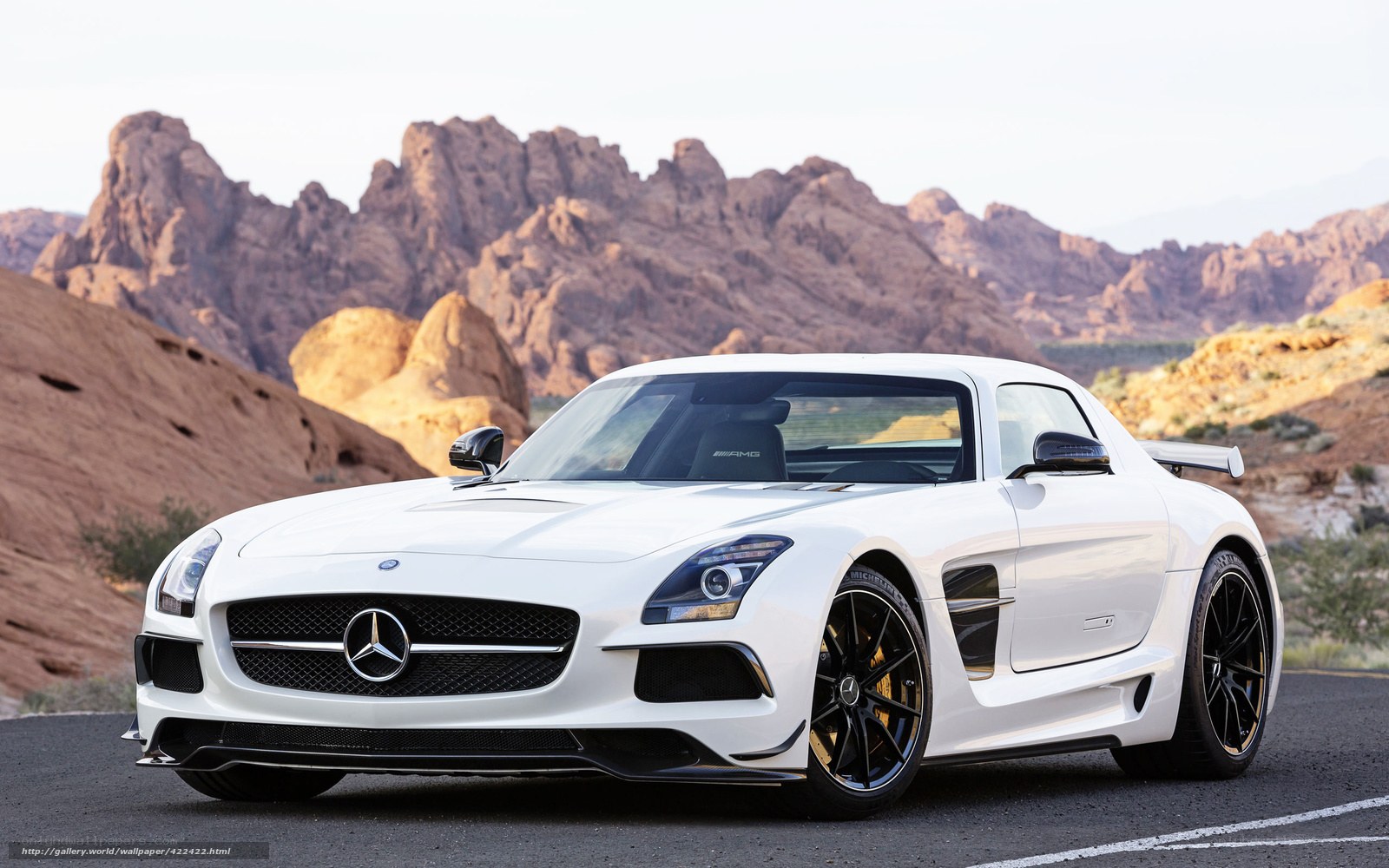 White Mercedes-Benz SLS AMG in desert