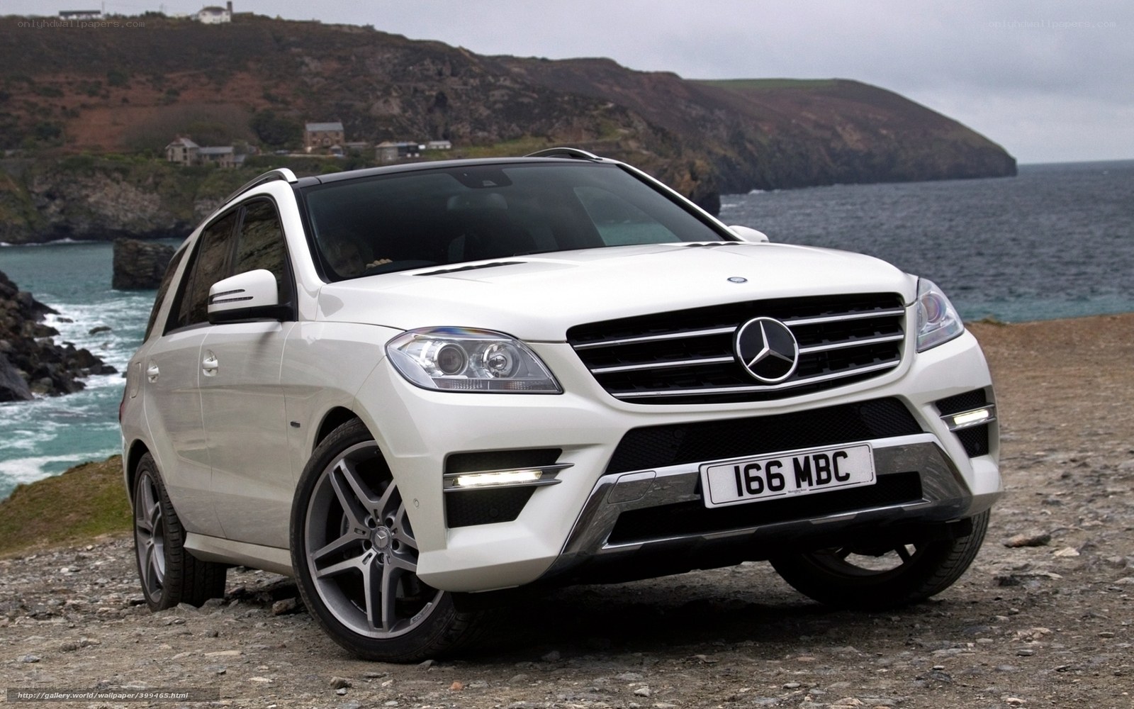 White Mercedes-Benz SUV by the coast