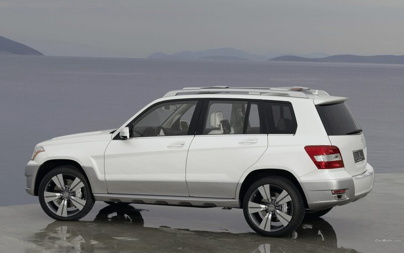 white mercedes-benz suv by the sea