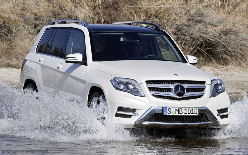 White Mercedes-Benz SUV driving through water