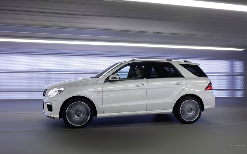 white mercedes-benz suv in motion