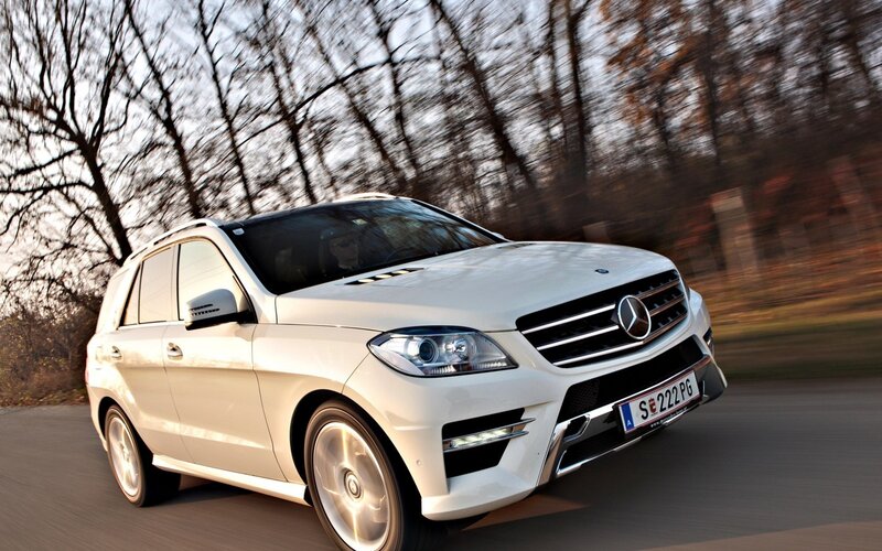 White Mercedes-Benz SUV in motion