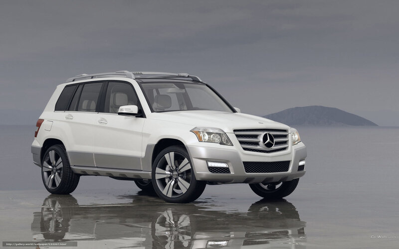 White Mercedes-Benz SUV on beach